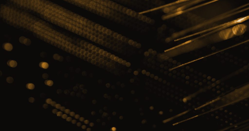 Dark server rack and fiber cabling representing a self-hosted analytics stack to back up